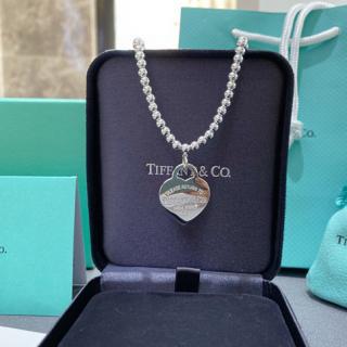 Elegant bead bracelet paired with engraved pendant