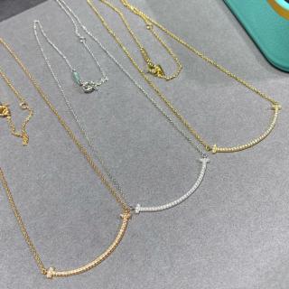 Smiling face necklace with diamonds